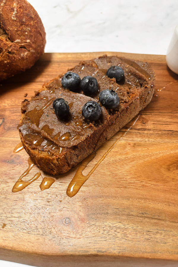 Creamy blueberry nut butter served with fresh blueberries and drizzled with honey
